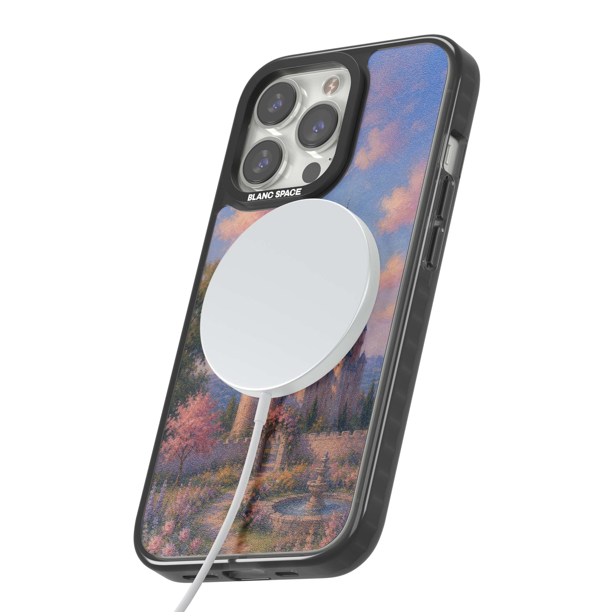 Enchanted Kingdom fairytale iPhone case featuring a romantic castle painting with cherry blossoms and pastel pink sky | Black Impact Magsafe case for iPhone 13 Pro, iPhone 14 Pro, iPhone 15 Pro